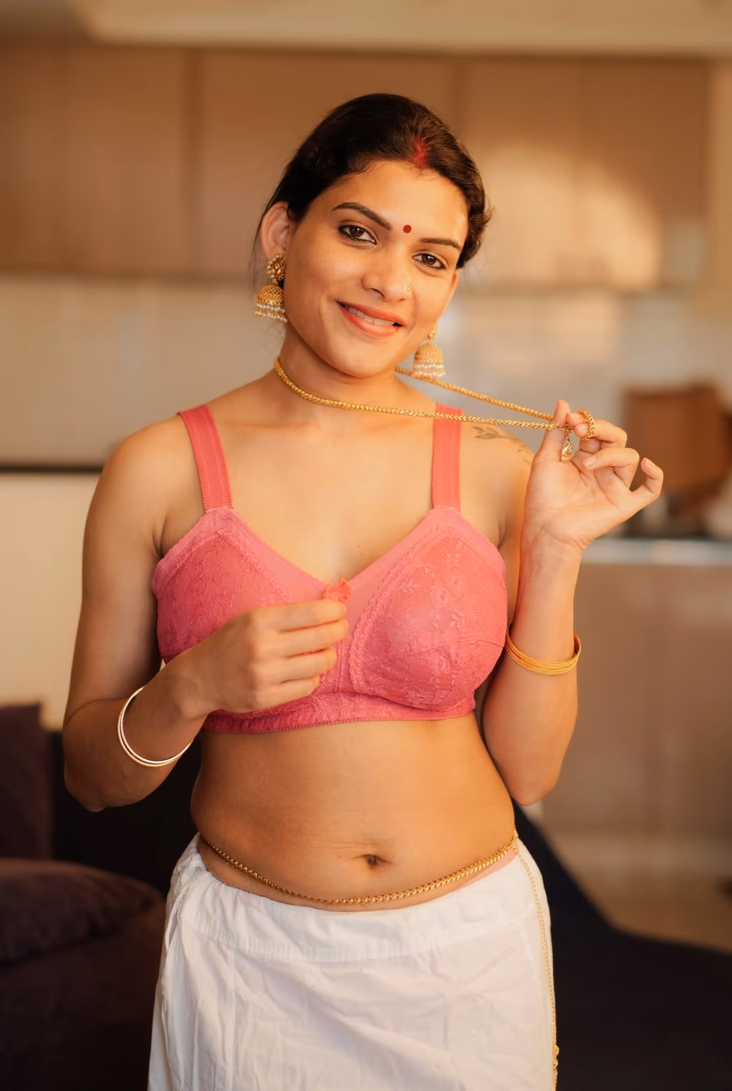 Image of Malayali owner Resmi Nair and her hot maid Tina Nandi strip naked and rub each other's pussy till they're soaking wet.